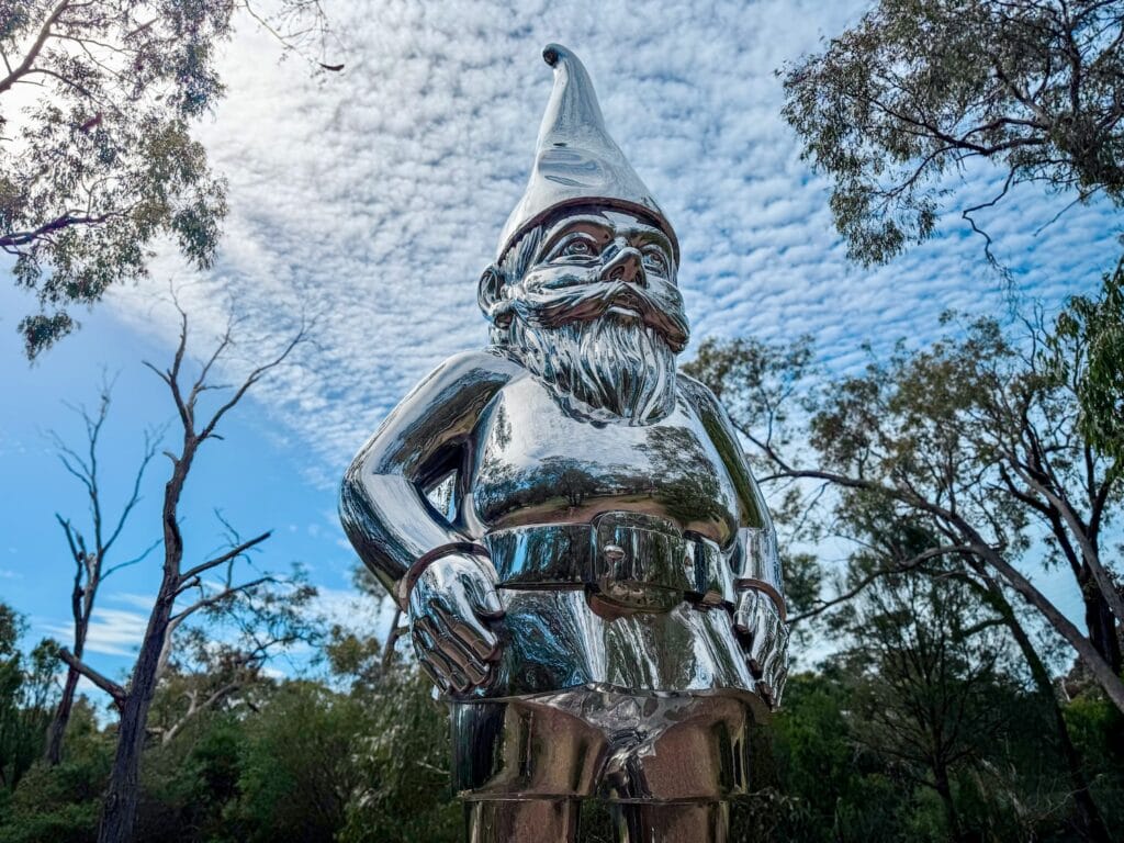 Giant silver gnome sculpture at McClelland Gallery. 